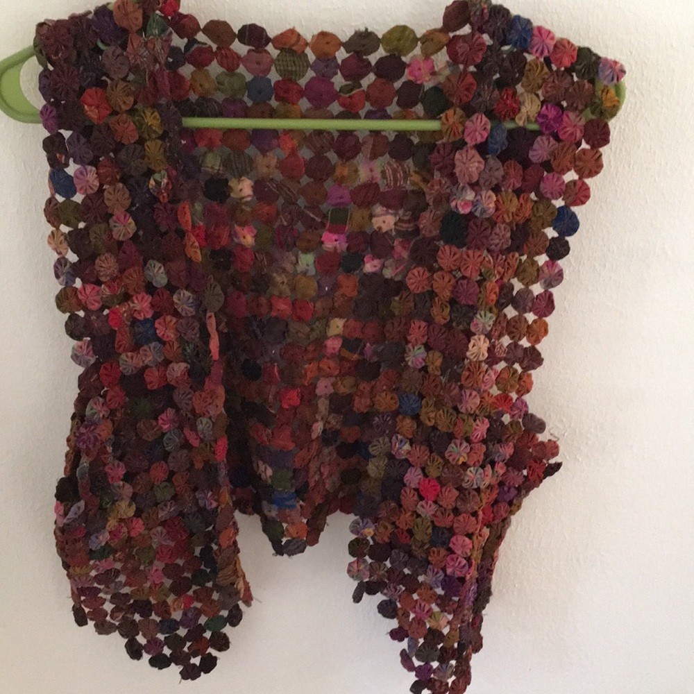 Vest made from little rosettes of fabric